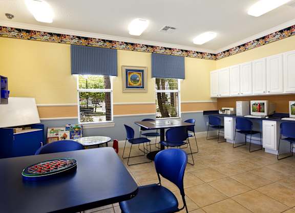 a large room with tables and chairs