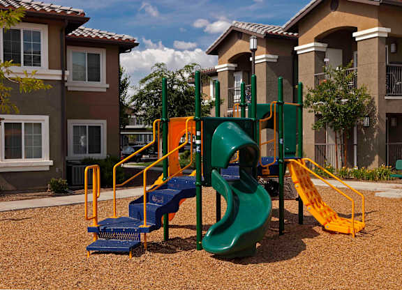 a playground at the whispering winds apartments in pearland, tx