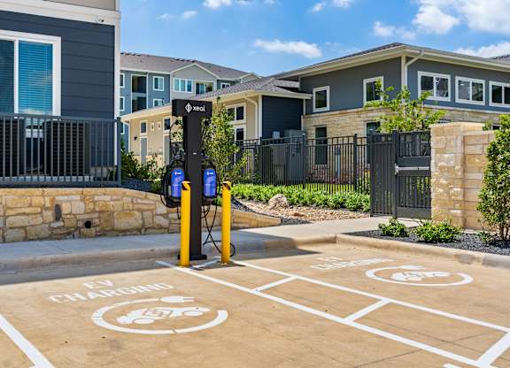 An electric vehicle charging station is located in a parking lot.