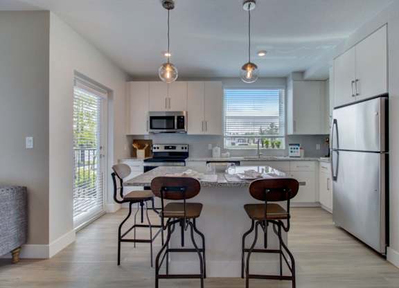 Kitchen with designer finishes at Everly Apartments in Naples, FL