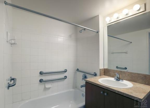 Bathroom with Grab Bars at Poinciana Grove Senior Apartments in Miami FL