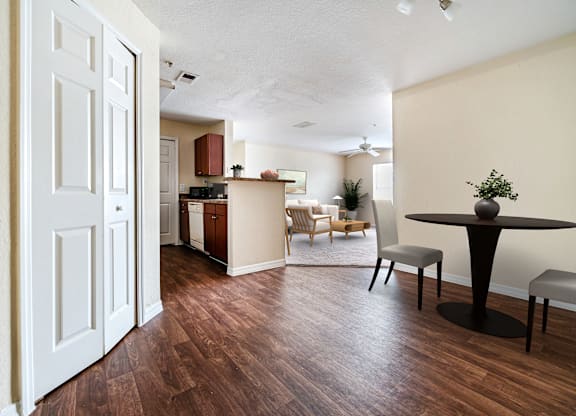 A room with a table and chairs in it.