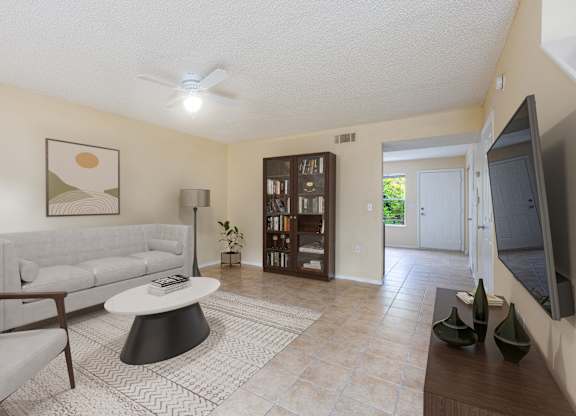 a living room with a white couch and a coffee table