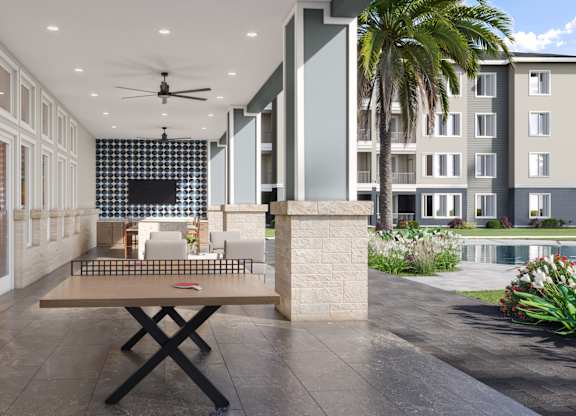 Outdoor Lounge with Yard Games at Cedar Heights Luxury Apartments in Austin, TX