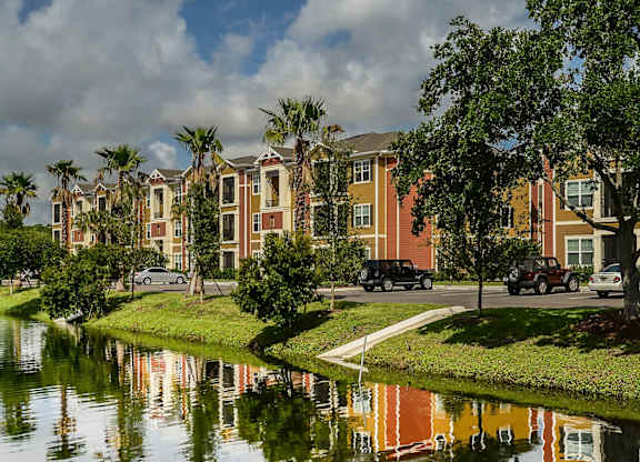 Nicely maintained landscaping with water views at The Amalfi Clearwater Apartments