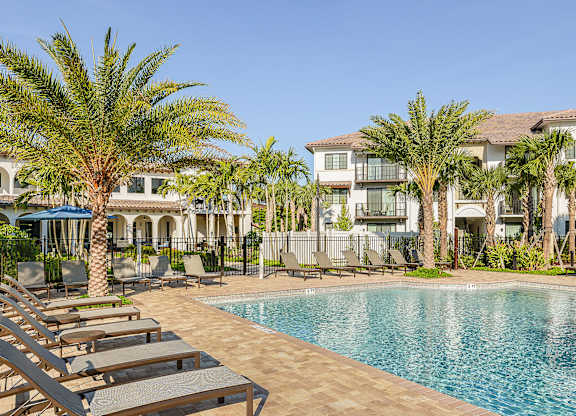 Pool with plenty of seating at Azura in Kendall, FL