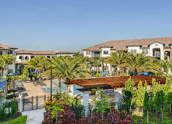 Lush landscaping and well maintained exterior homes at Azura in Kendall, FL
