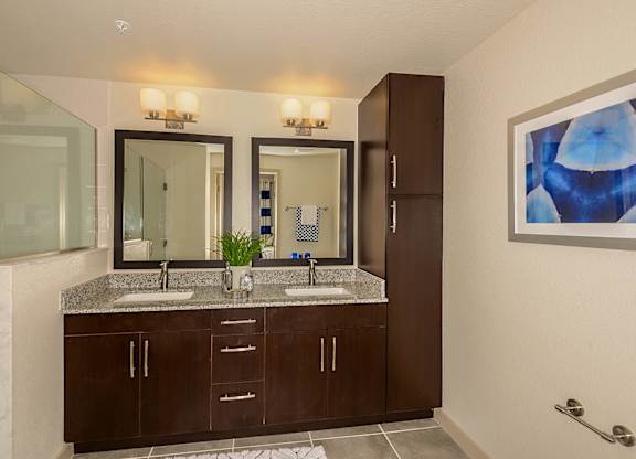 Bathroom with double sinks in select homes at Azura in Kendall, FL