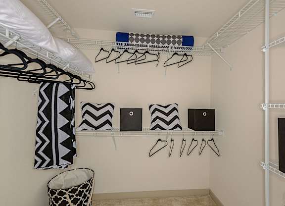 Walk-in closet with built in shelving at Azura in Kendall, FL