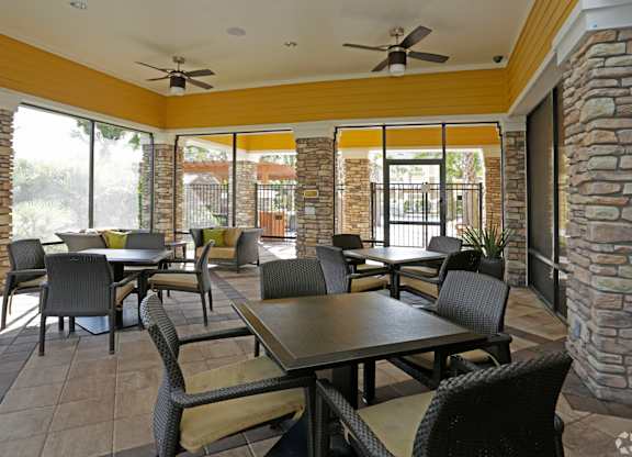 A patio with a table and chairs.