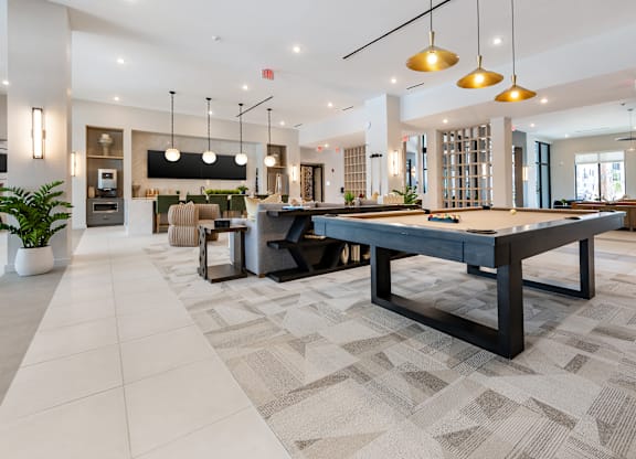 Clubhouse with Billiards and Entertainment Kitchen at Marquee Square Apartments in Tampa, FL