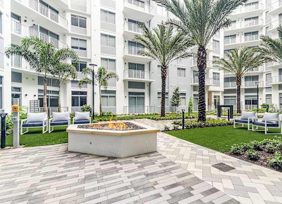 Courtyard with Fire Pits at The Marc Luxury Apartments in Palm Beach Gardens FL