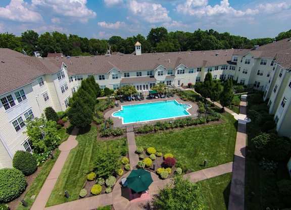 Garden Courtyard and Swimming Pool at The Kentshire Senior Apartments in Midland NJ