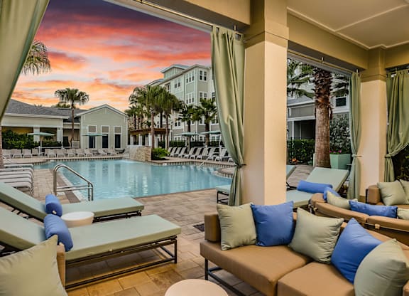 Lounge Seating by the Pool at Epic at Gateway Luxury Apartments in Pinellas County FL