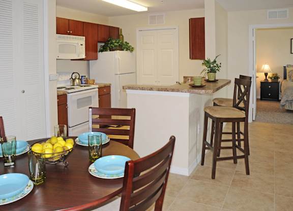 Kitchen and Dining Area at Hudson Ridge Apartments in Port Richey, FL