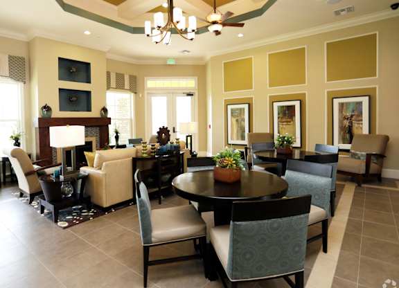 A large dining room with a table set for six.
