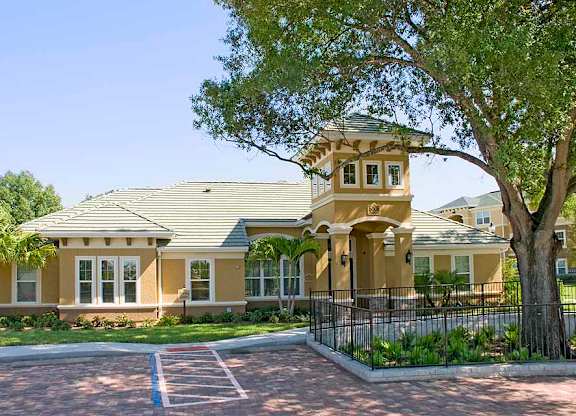a large house with a large tree in front of it