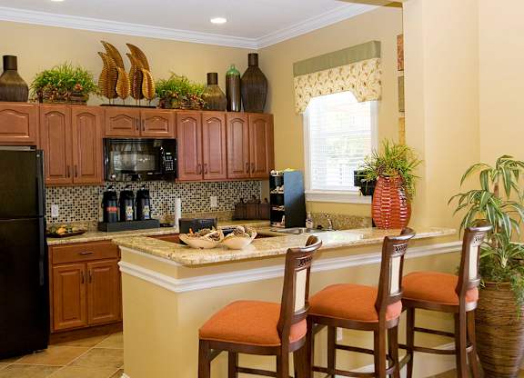 a kitchen with a counter top and a refrigerator