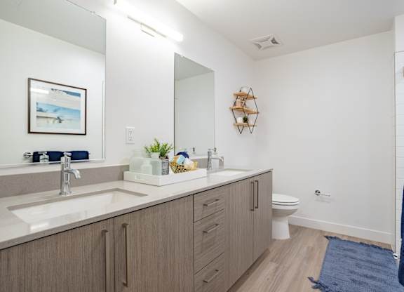 Double sink vanity with plenty of storage in the bathroom at Chandler Apartments in North Hollywood, California, 91601