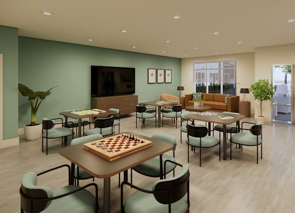 A room with a chess board on a table surrounded by chairs.