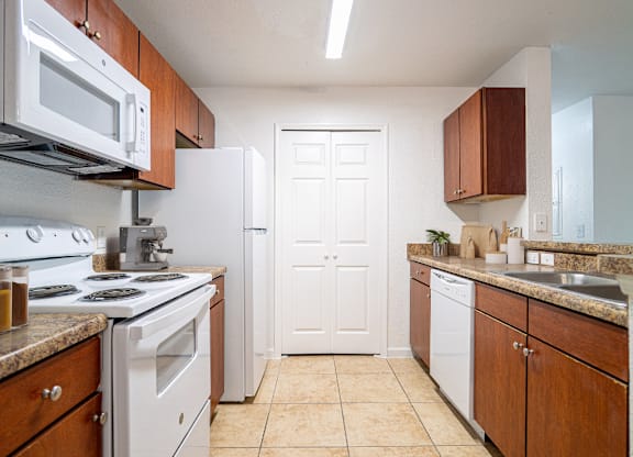 Chef Style Kitchen with Bar Seating at Timber Trace Apartments