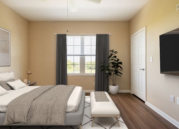 A bedroom with a bed, a bench, and a ceiling fan.