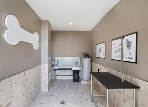 A bathroom with a bone decoration on the wall.