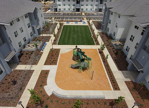 Playground and Green Area at The Retreat Affordable Apartments in Merced CA