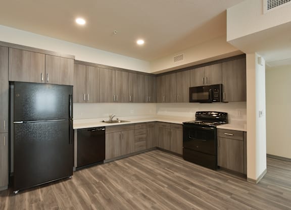 Kitchen with All Black Appliances at The Retreat Affordable Apartments in Merced CA