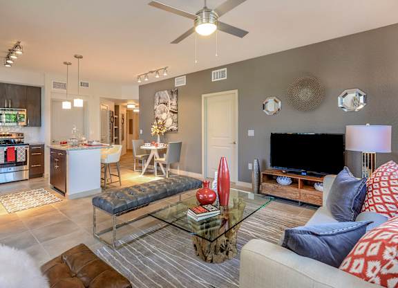 Living room with tiled floors at Palm Ranch Apartments in Davie, FL