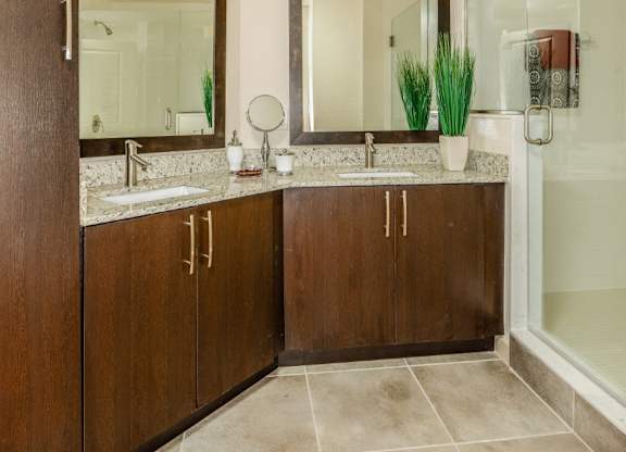 Bathroom with double sinks at Palm Ranch Apartments in Davie, FL