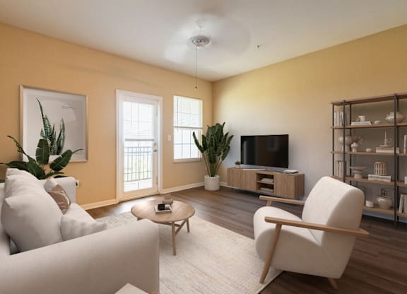 A living room with a white sofa, a wooden coffee table, a television, and a bookshelf.
