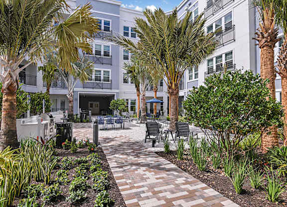 Outdoor garden courtyard at The Foundry Luxury Apartments in Tampa FL
