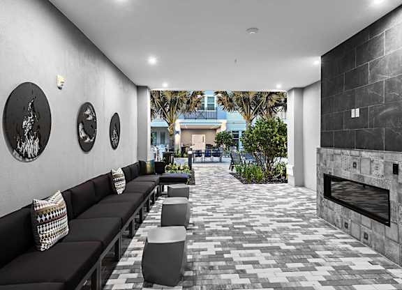 Poolside outdoor sitting area at The Foundry Luxury Apartments in Tampa FL