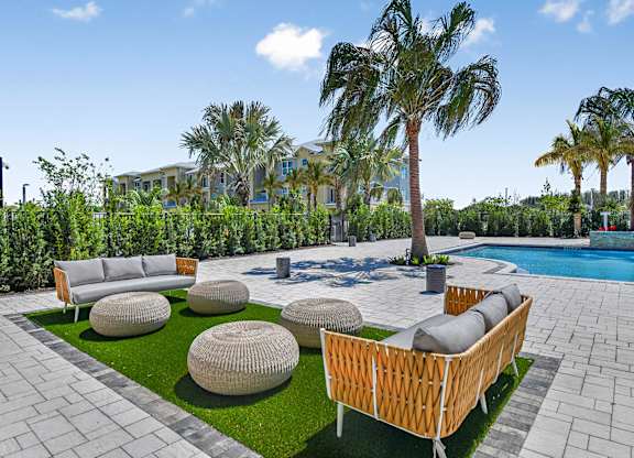 Pool Lounge Area at The Gallery Luxury Apartments in Trinity, FL