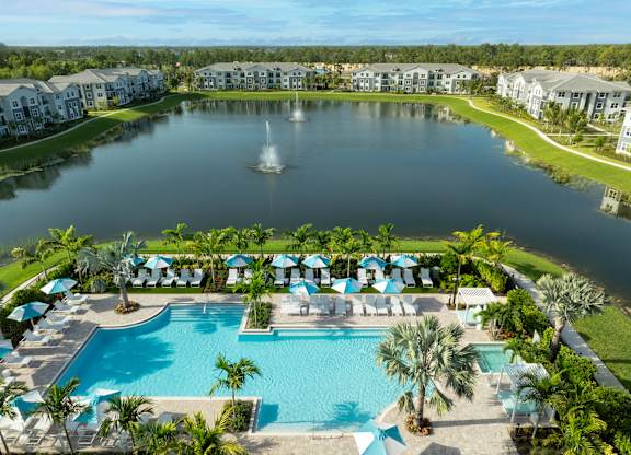 Resort-Style Pool Overlooking Pond at Everly Apartments in Naples, FL