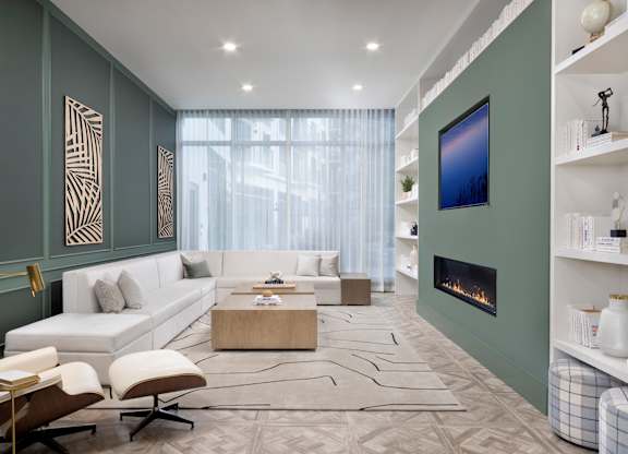 Library with Fireplace at The Marc Luxury Apartments in Palm Beach Gardens FL