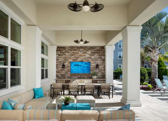 Covered Veranda and Lounge Seating at Waverly Terrace Luxury Apartments in Temple Terrace, FL