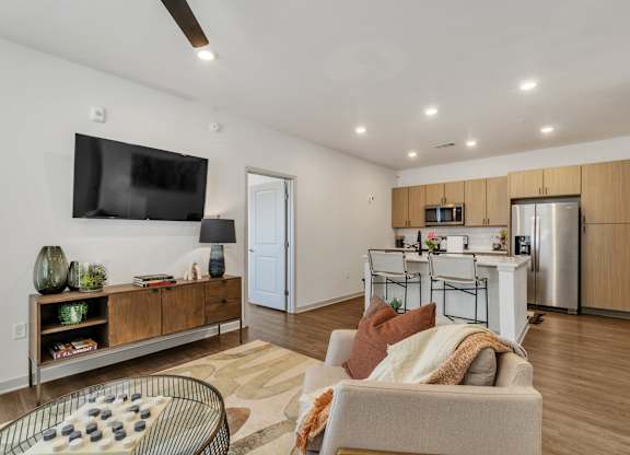 the living room and dining area at Apex apartments in Colorado Springs, CO