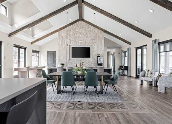 a large dining room with a large table and chairs