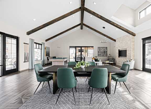 a large dining room with a large table and chairs