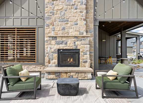 a living room with couches and a fireplace