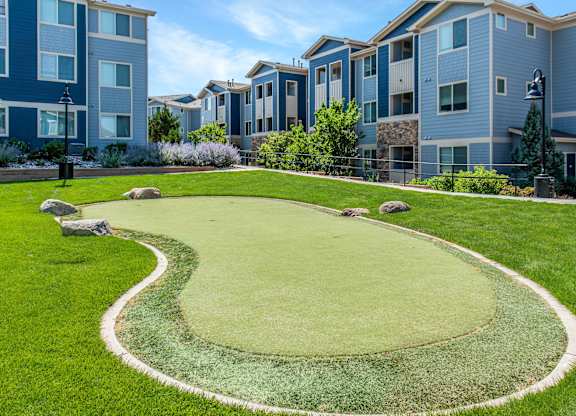A grassy area with a white border around a green area.