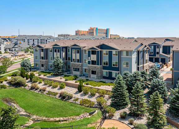 Apartments with a green lawn in front.