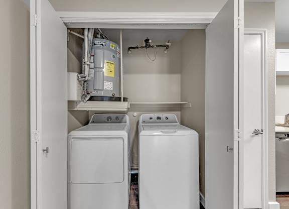 A laundry room with a washer and dryer.