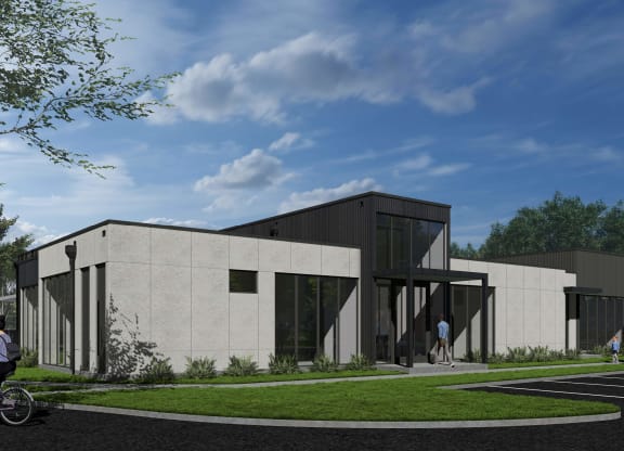 a rendering of a concrete building with a lawn and a sidewalk