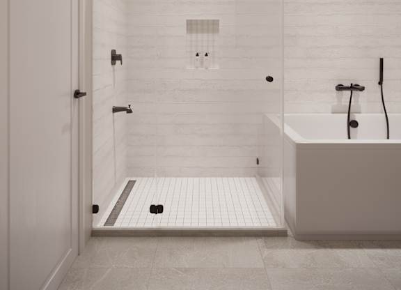 A white bathroom with a walk in shower and a bathtub.