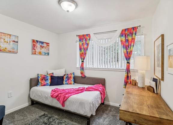 a bedroom with a bed and a window at Oaks at Oxon Hill, Oxon Hill, Maryland