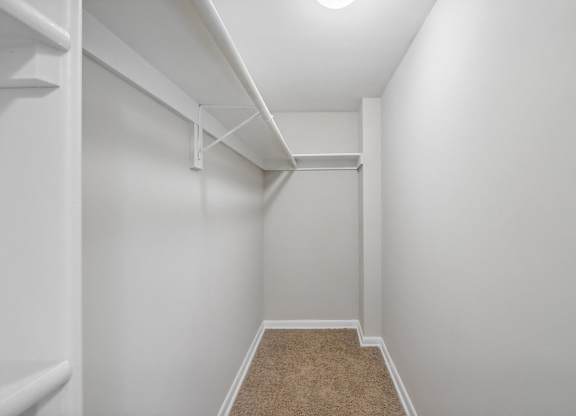 a spacious closet in a home with white walls and carpet at Andrews Ridge Apartments, Suitland, MD