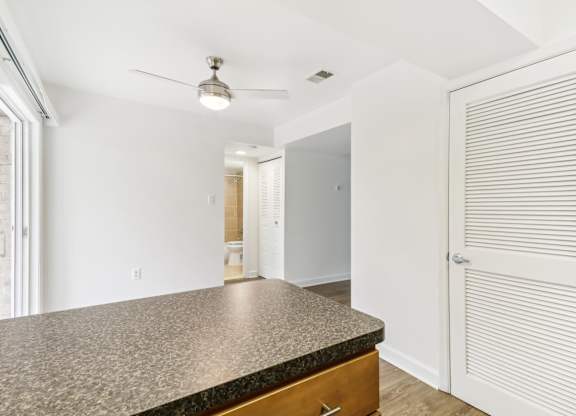 a kitchen with a counter top and a door to a hallway at Oaks at Oxon Hill, Oxon Hill, Maryland